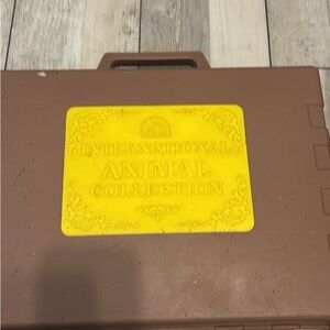 International animal collection case with horses